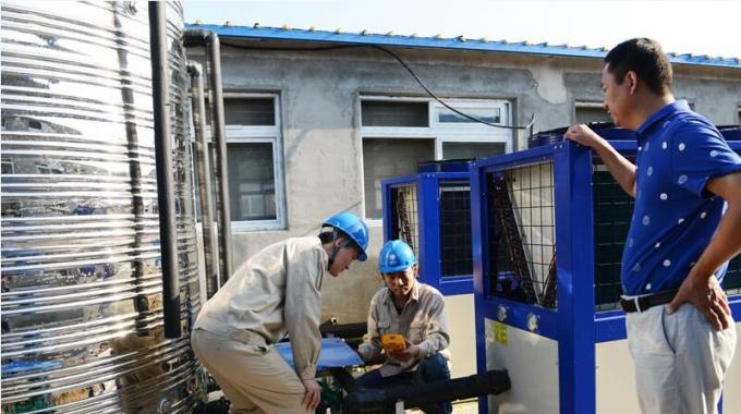 空气源热泵供暖养猪示范点送电成功